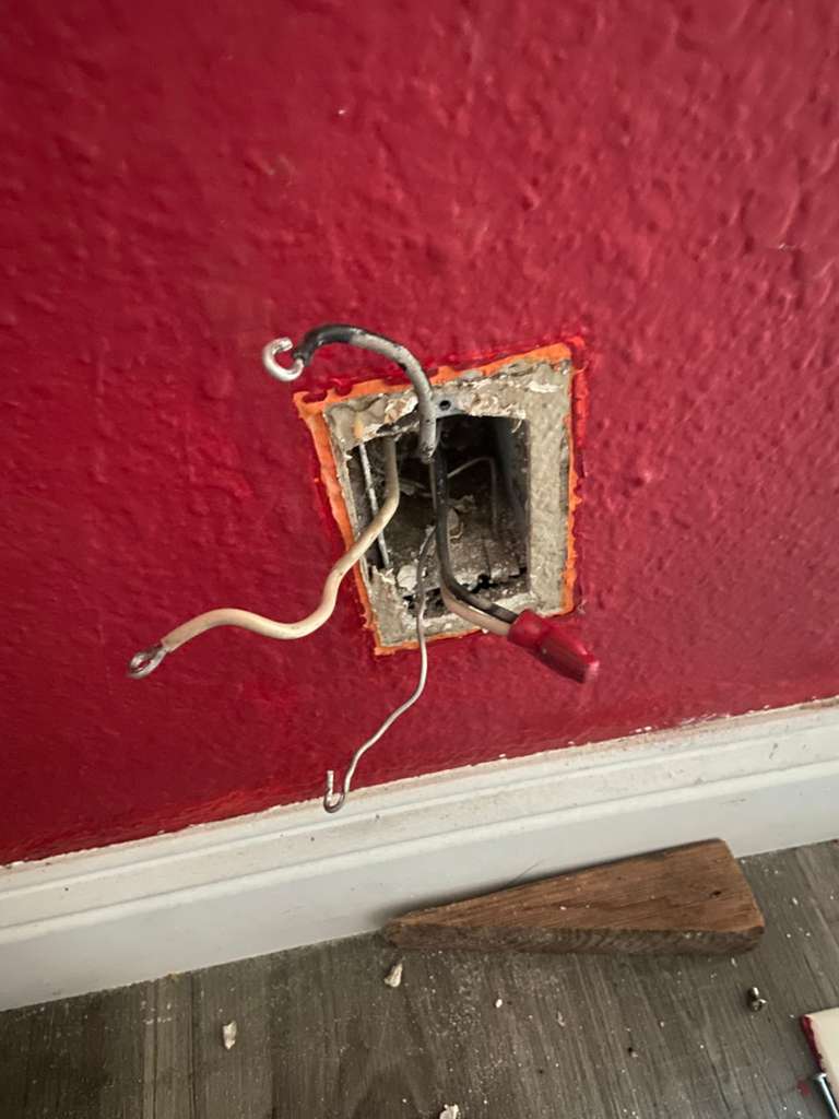 Electrical outlet repair on the job
